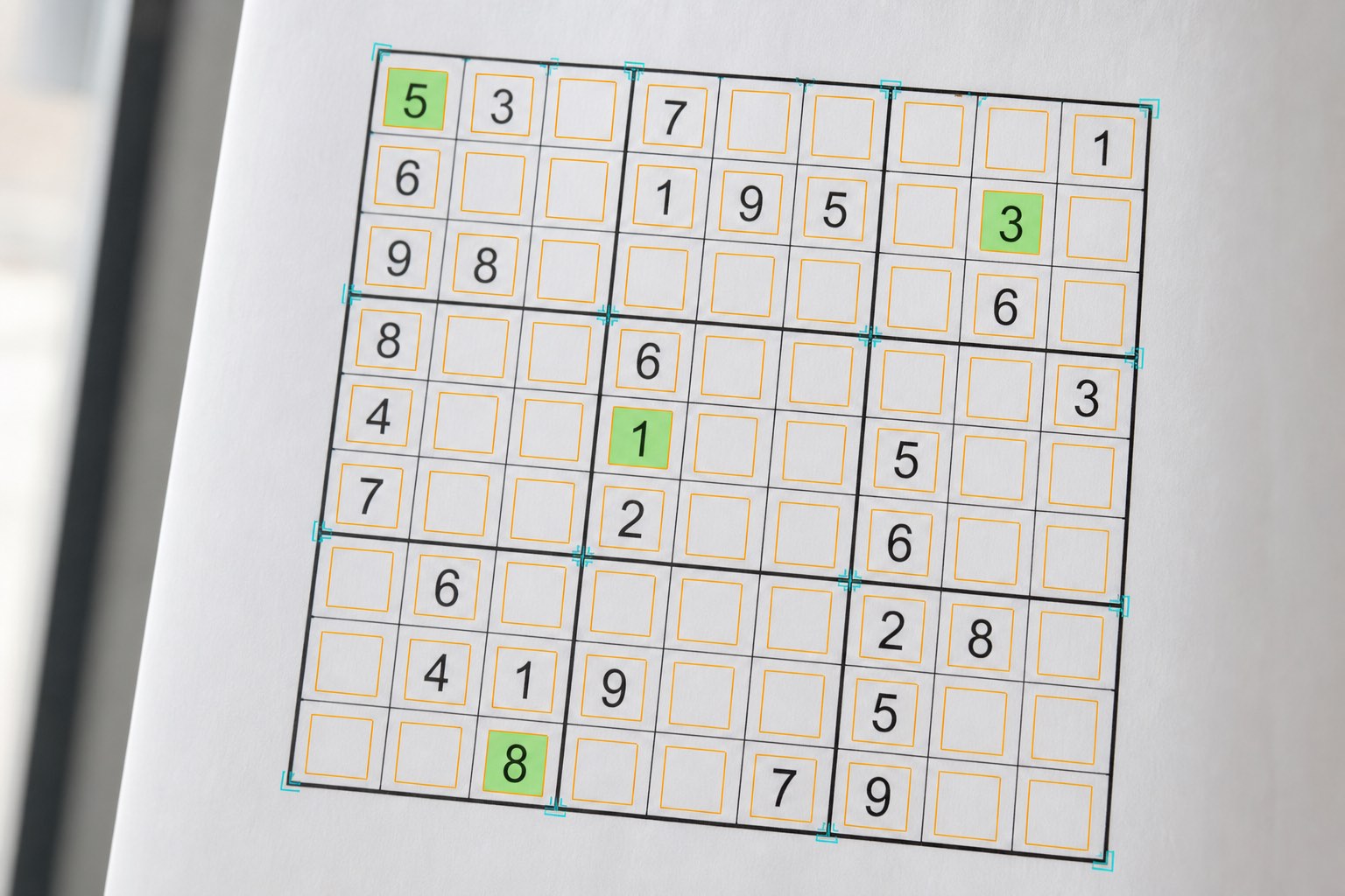 Printed Sudoku grid with computer-vision cell detection overlay